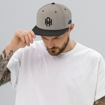 Initial snapback cap