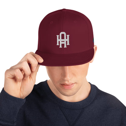 Initial snapback cap